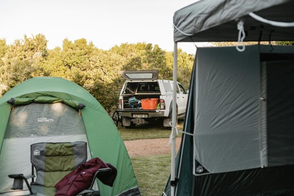Different types of camping styles including tent camping, car camping, backpacking, and glamping