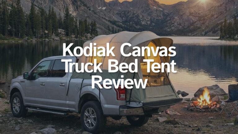 Kodiak Canvas Truck Bed Tent set up on a pickup truck near a lake.