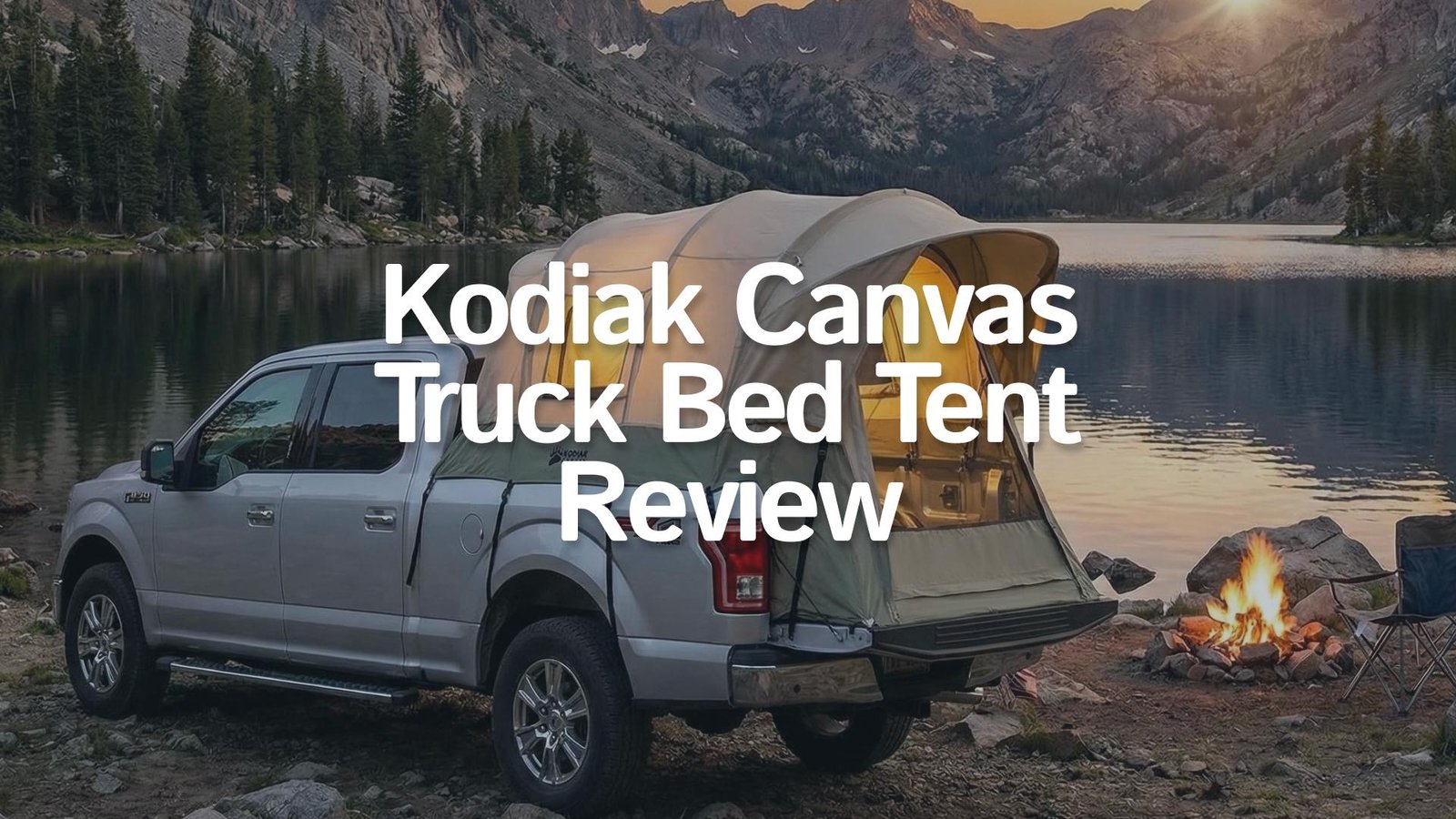 Kodiak Canvas Truck Bed Tent set up on a pickup truck near a lake.