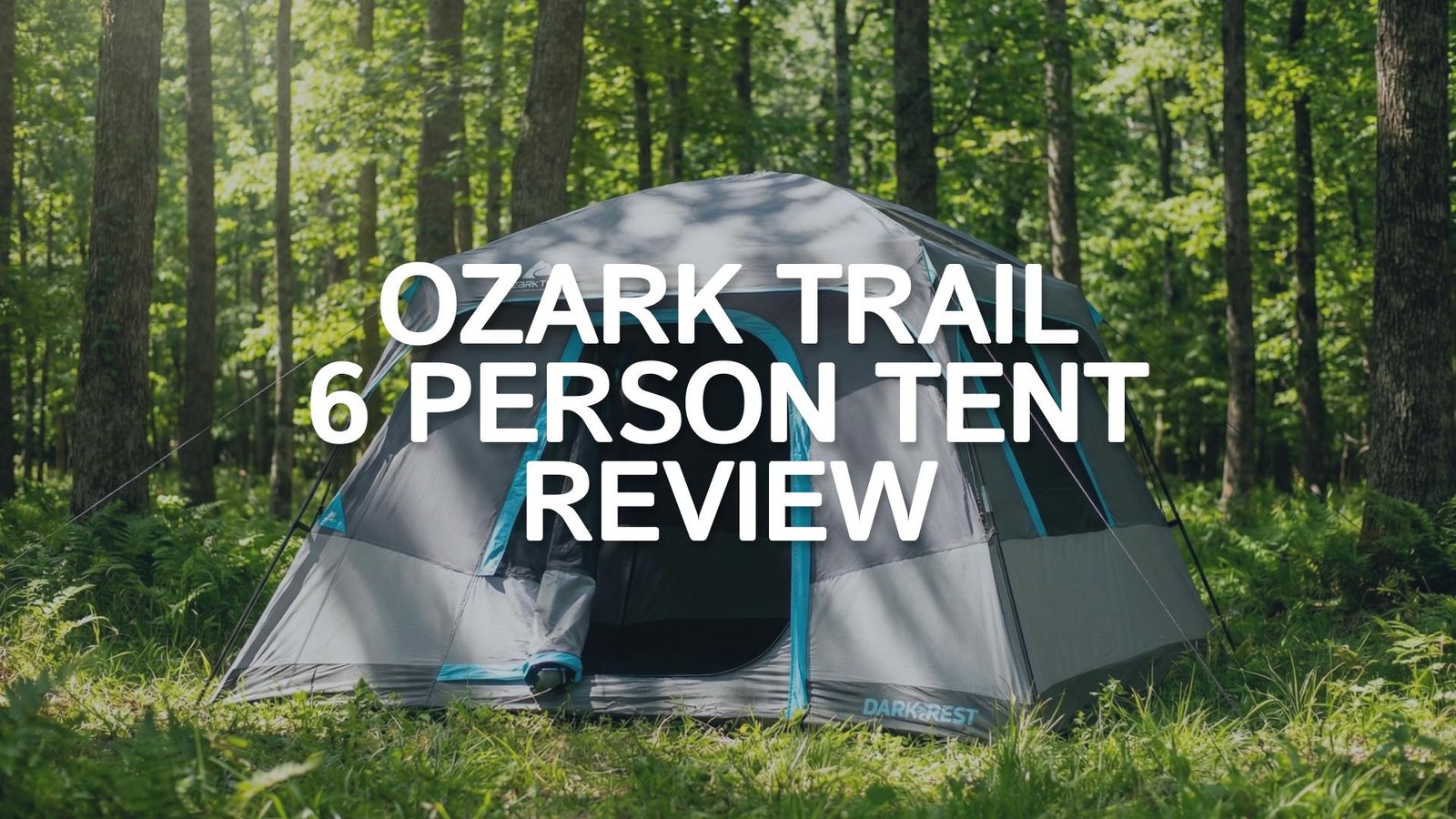 Ozark Trail 6 Person Dark Rest Tent pitched in a sunny forest with dark interior visible.