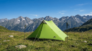 A 3F UL Gear Lanshan 2 trekking pole tent set up in a scenic mountain valley.