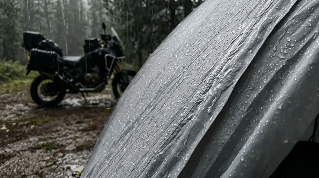 Rain beading on the waterproof rainfly of a TETON Sports Mountain Ultra 2 tent during a motorcycle camping trip.