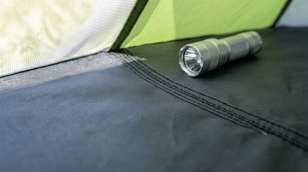 A detailed close up of the thick 210D Oxford waterproof floor and reinforced seams on an Ayamaya tent.