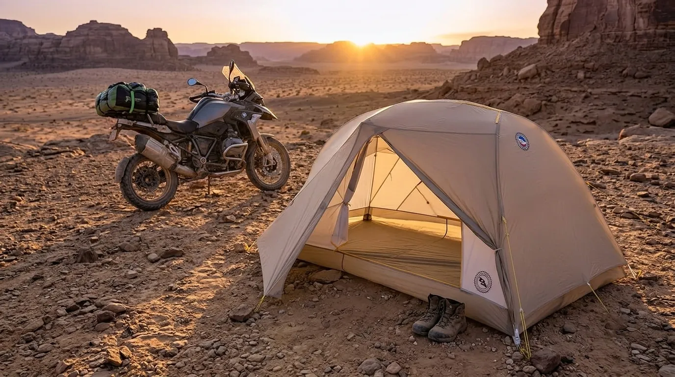 A Big Agnes Tiger Wall UL2 Bikepack tent set up in a desert campsite next to a motorcycle.