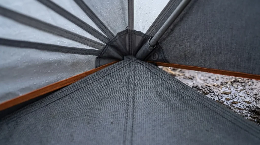 A detailed view of the thick waterproof floor and inverted seams on a Bushnell instant cabin tent.