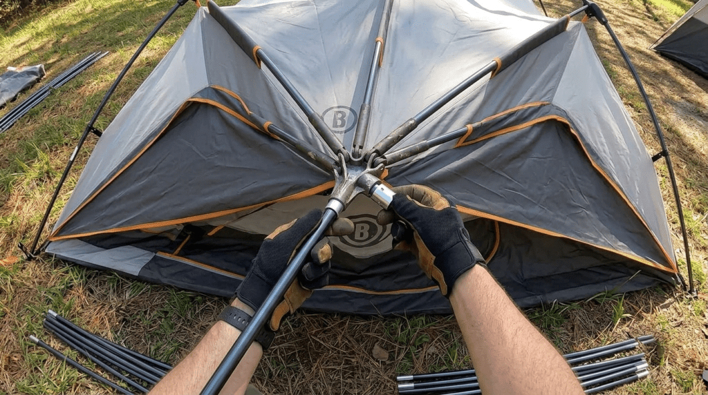 A close up view of the steel telescopic poles clicking into place on a Bushnell instant tent.