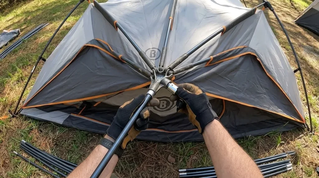 A close up view of the steel telescopic poles clicking into place on a Bushnell instant tent.