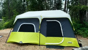 Core 9 Person Instant Cabin Tent set up in a campsite.
