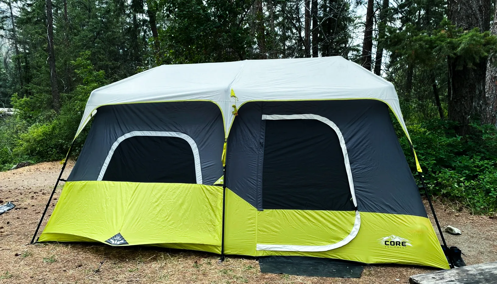 Core 9 Person Instant Cabin Tent set up in a campsite.