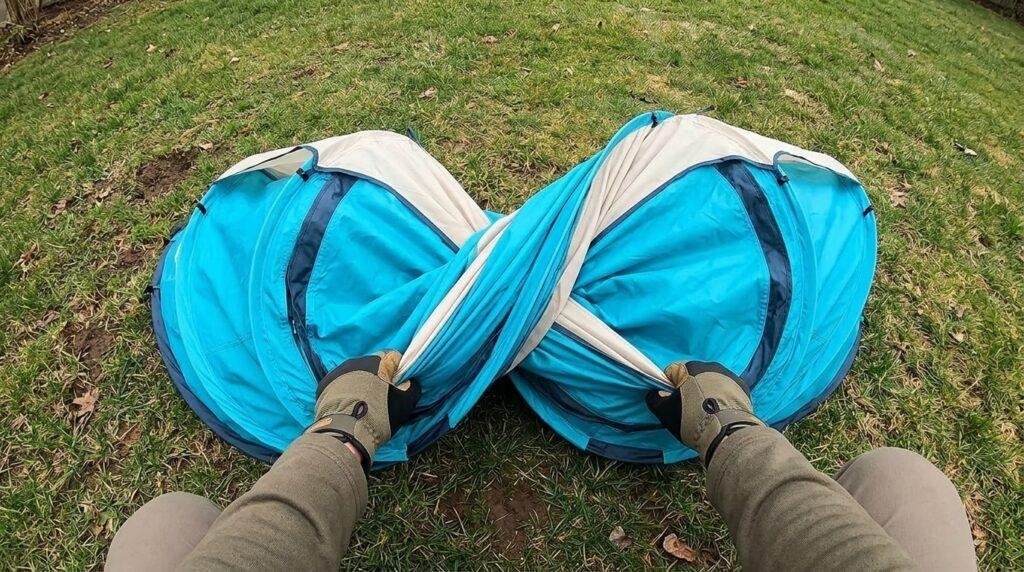 A demonstration of the figure eight folding technique used to pack the Coleman pop up tent.
