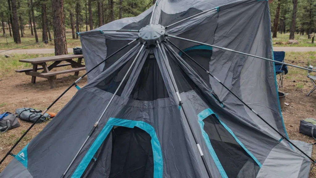 Camper extending the telescoping poles of the Ozark Trail 6 person tent.