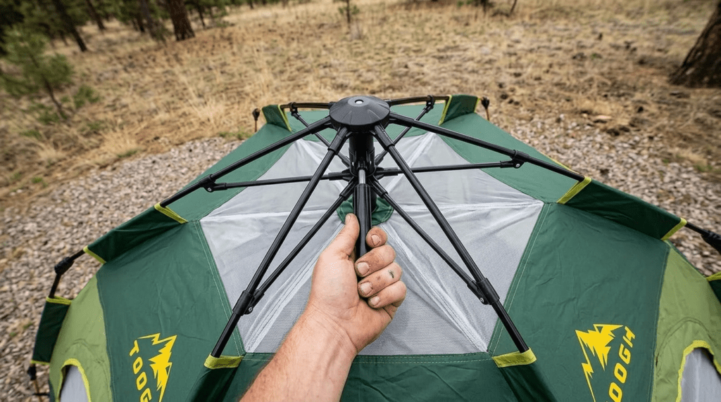 A close-up view of the manual lift-and-lock hub system on a Toogh tent.