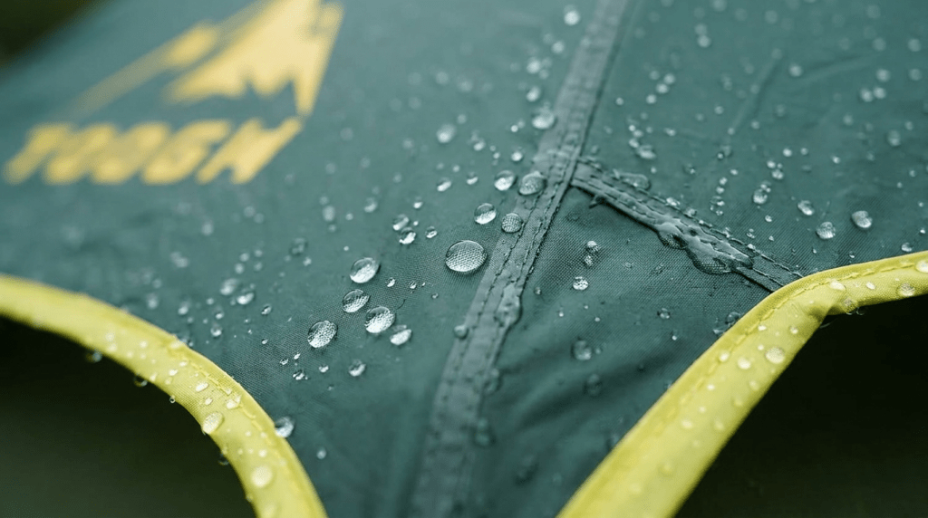A close-up view of water beading on the 3000mm waterproof fabric of a Toogh tent.
