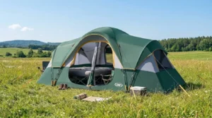 A UNP 10 person tent for family, fully pitched in a meadow.