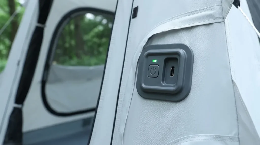 A close up view of the one-button automatic pump on the Fseoot automatic inflatable tent.
