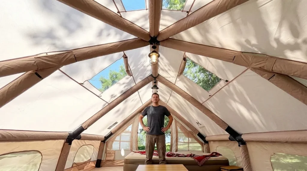 The spacious interior and standing room height of a TOMOUNT inflatable tent.