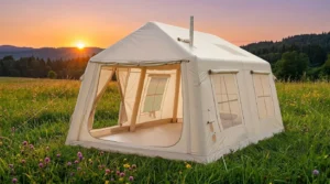 A Ytaoeo large inflatable camping tent with an AC unit connected at a campsite.