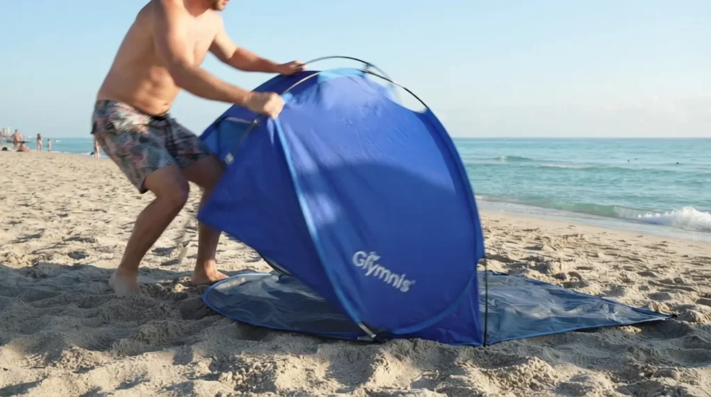 Setting up a beach pop up tent in seconds on the sand