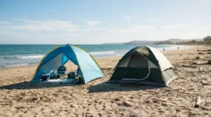 A pop up beach sun shelter and a dome camping tent set up side by side for comparison