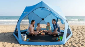 Family sitting in a circle inside an Acacia pop up tent on the beach