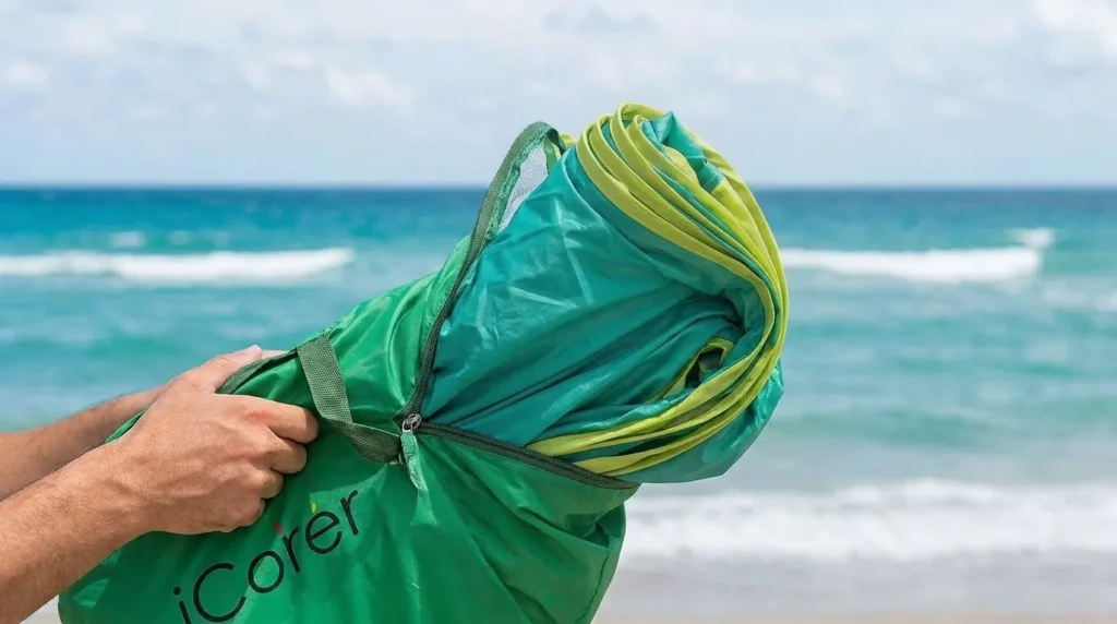 Automatic pop up beach tent springing open on the sand