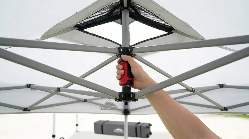 How to put up a pop up canopy tent: Pressing up the PeakPush center lock on an Eagle Peak pop up canopy tent
