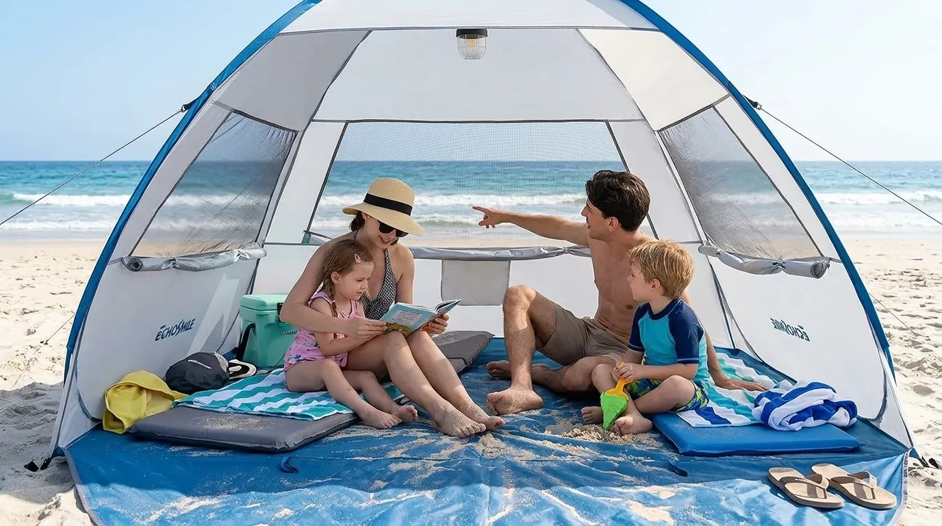Family sitting inside an EchoSmile pop up tent on the sand